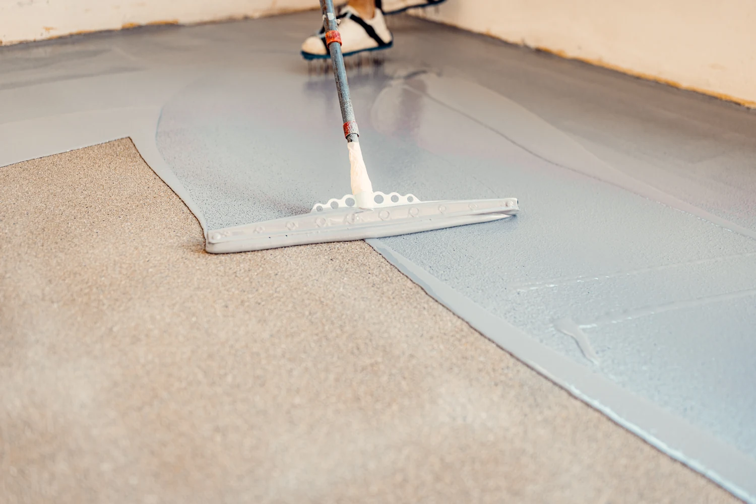 A new protective coating being applied to a concrete floor